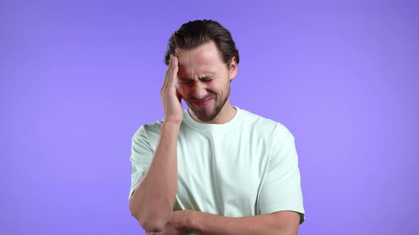 Young Man Having Headache Studio Portrait