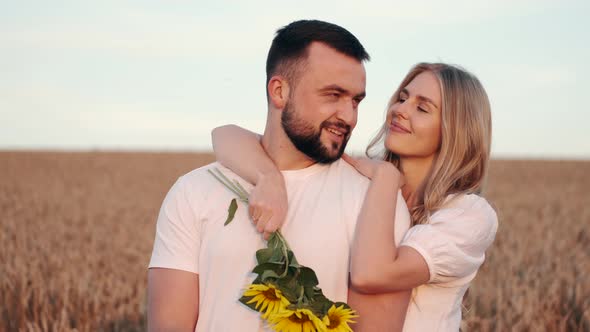 Young Beautiful Couple in a Wheat Field