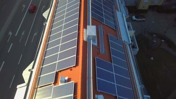 Solar power panels on top of residential building roof for producing of green ecological electricity
