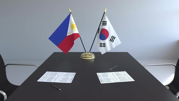 Flags of the Philippines and South Korea on the Table