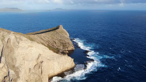 Drone flying behind rabbit island and the secret tide pools in hawaii