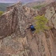 Mountaineer Climbs To the Top. Drone Shot. - VideoHive Item for Sale