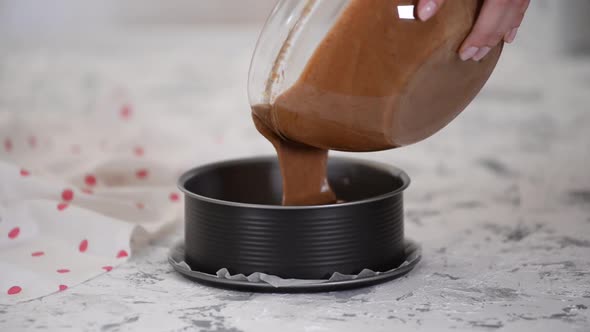 Pouring Cake Mix Into Baking Tin