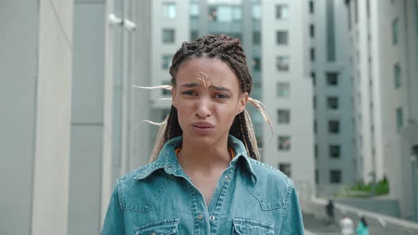 Closeup Portrait of African American Girl with Dreadlocks Getting a Headache and Being Totally or