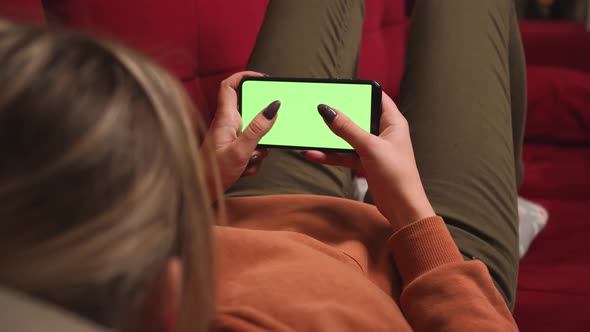 Close Up Woman Hands Holding Chromakey Green Screen Smartphone Watching Content Swiping Scrolling