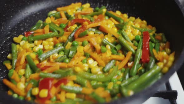 Mix Of Different Vegetables Fried In A Hot Frying Pan