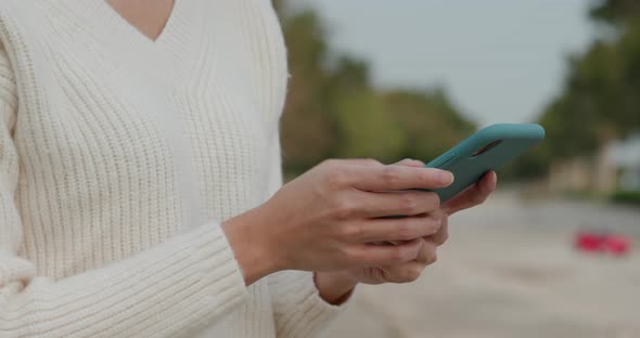 Woman use of smart phone at street