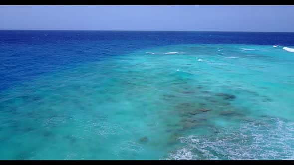 Aerial nature of marine tourist beach journey by blue lagoon and bright sand background of a dayout 