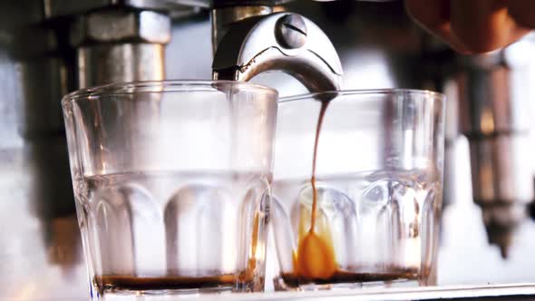 Close-up of espresso pouring from coffee machine