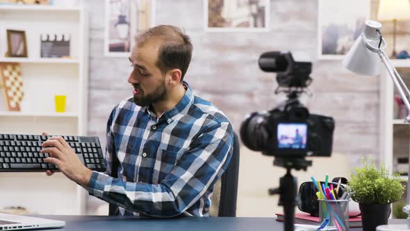 Famous Vlogger Filming Keyboard Review for His Followers