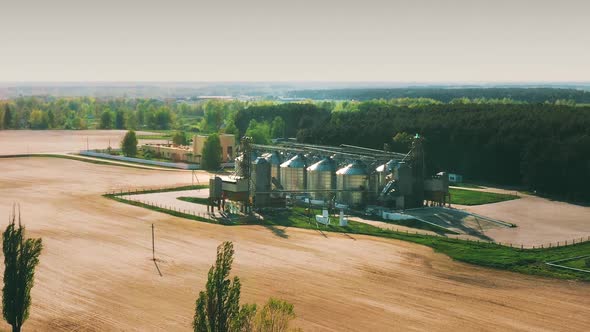 Aerial Elevated Top View Modern Granary Graindrying Complex Commercial Grain Or Seed Silos In Sunny