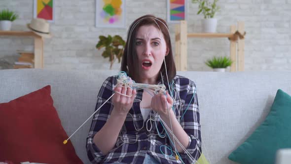 Young Woman Does Not Know How To Knit Slow Mo