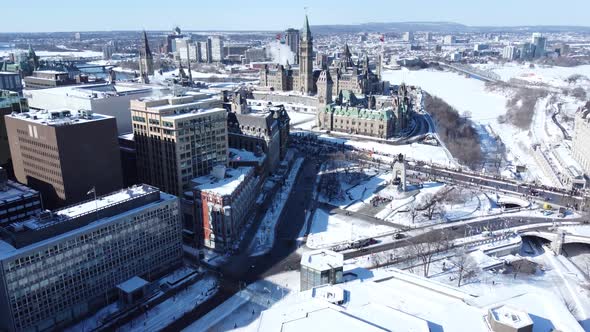 Aerial forward view over city and its old cathedral with snow and its old cathedral. Ottawa. Canada