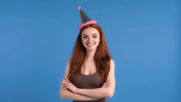 Ginger Girl in Party Hat and Khaki Tank Top