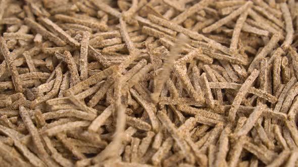 Cereal wheat fiber sticks. Falling onto a heap in slow motion