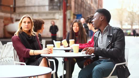 Authentic shot of people in a cafe, meeting, talking and using phones