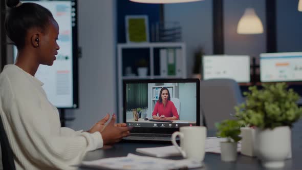 African Businesswoman Discussing with Remotely Woman Partner