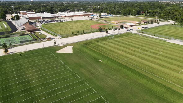 American Sports - Football, Soccer, Tennis, & Baseball Fields - Aerial Drone Establishing View