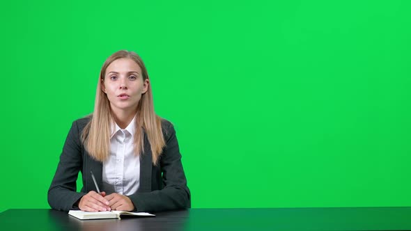 Caucasian Female Interviewer is Sitting at a Table and Talking to an Interlocutor a Firstperson View