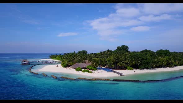 Aerial drone view nature of tranquil resort beach break by blue green lagoon and white sandy backgro