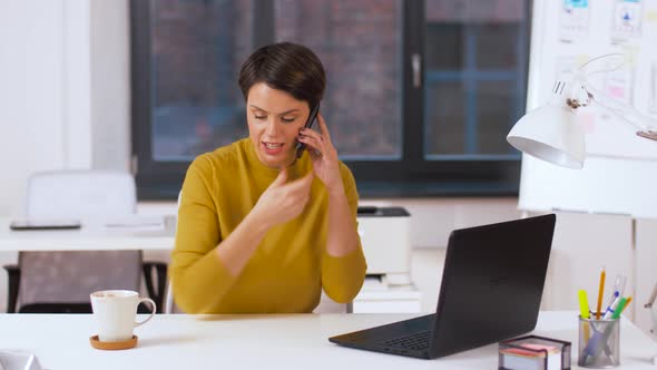 Businesswoman Calling on Smartphone at Office 11