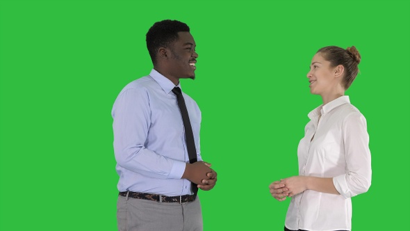 Afro american guy and girl talking about business on a