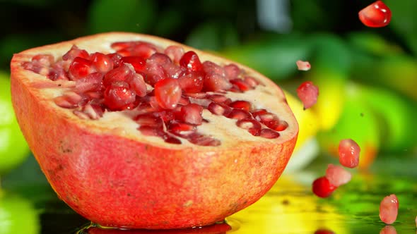 Super Slow Motion Shot of Falling Seeds on Fresh Pomegranate at 1000Fps