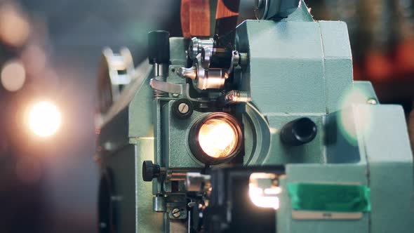 Vintage Projector Finishes Processing a Film Tape