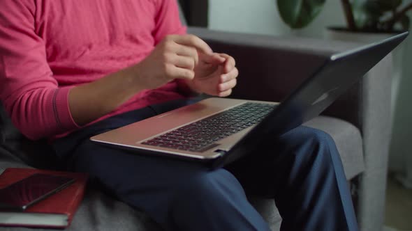 Deaf Male Hands with Laptop Online Messaging
