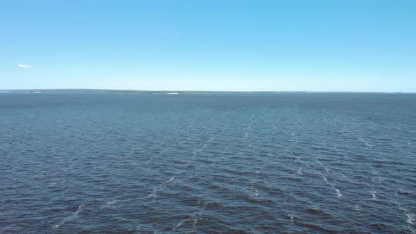 Panorama of a wide river on a bright day