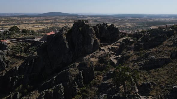 Penha Garcia Castle and surrounding landscape in Portugal. Aerial forward