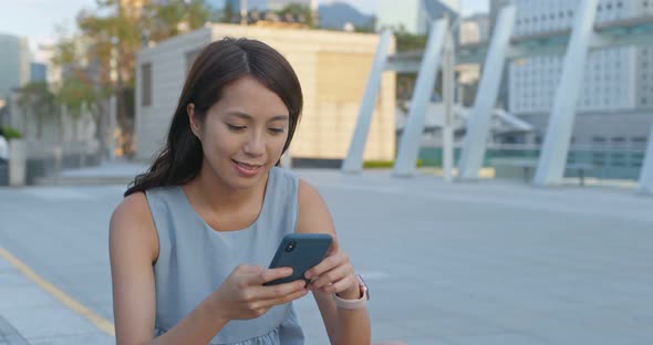 Woman Use of Mobile Phone for Online in City