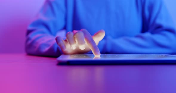 Woman use of tablet computer at home