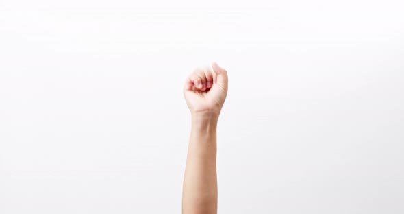 Hand showing OK thumbs up scissors victory chroma key isolated on a white studio background with cop