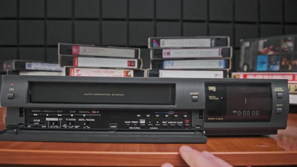 Insert VHS Cassette Into VCR and Push Play Button