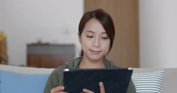 Woman look at the tablet computer at home