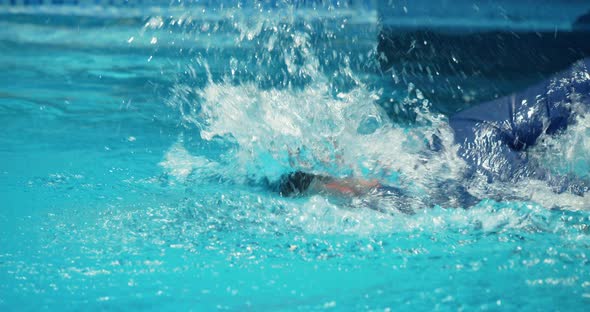 Young Male Swimmer Performing Front Crawl Technique