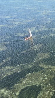 Boat Boats in the Ocean Near the Coast of Zanzibar Tanzania Slow Motion Vertical Video