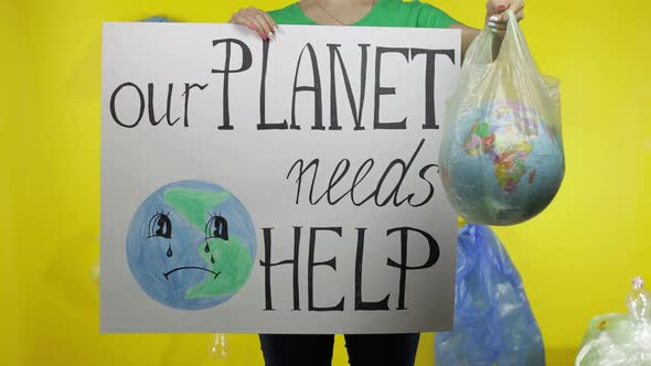 Unrecognizable Woman with Protesting Poster and Earth Globe in Plastic Package. Ecology Pollution