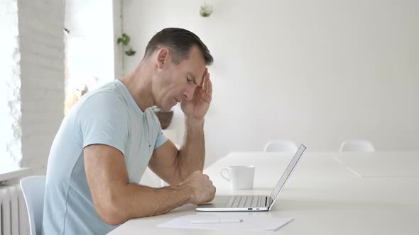 Headache Man in Tension Working in Office Pain