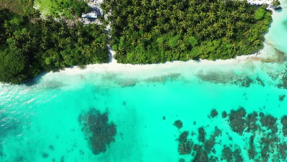 Aerial top down texture of idyllic lagoon beach lifestyle by blue sea with white sand background of 