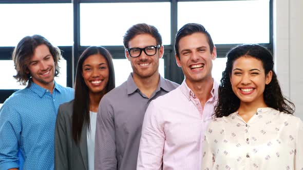 Portrait of businesspeople standing and smiling