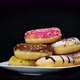Donuts in Plate Being Picked Up - VideoHive Item for Sale