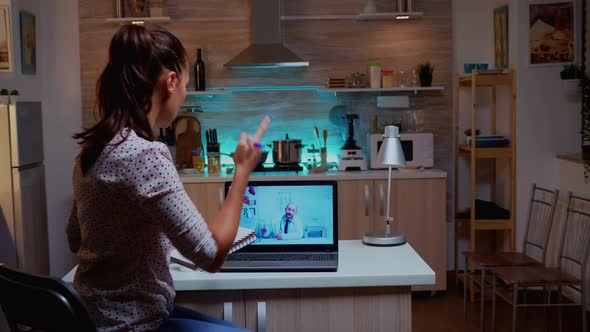 Doctor Giving Virtual Advice and Patient Taking Notes