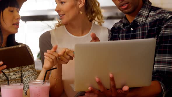 Executives discussing over laptop 4k