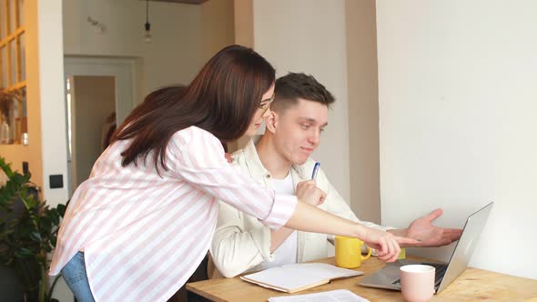 Young Happy Family Planning Their Holiday, Buying Tickets Online.