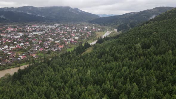 Village in the Carpathian Mountains in Autumn. Slow Motion, Aerial View