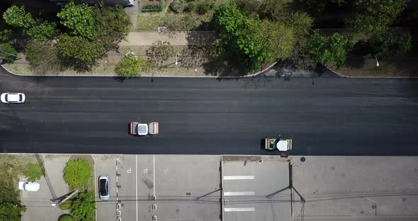 Aerial Top Down View of Asphalting Construction Works with Commercial Repair Equipment Road Roller