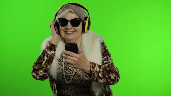 Elderly Caucasian Grandmother Woman. Dance, Celebrate, Listen Music. Chroma Key