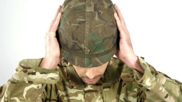 Soldier wearing combat helmet on white background